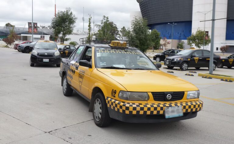 The Environmental, Social and Economic Impacts of Reducing Emissions in Taxi Fleets in Cities